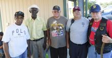 Levonia Rivers, Don Wannamaker, Franklin Williams, and Joseph Chen, North-area veterans who served in the Army, join Will Branlett who served in the Army National Guard and wait for the fireworks in North.